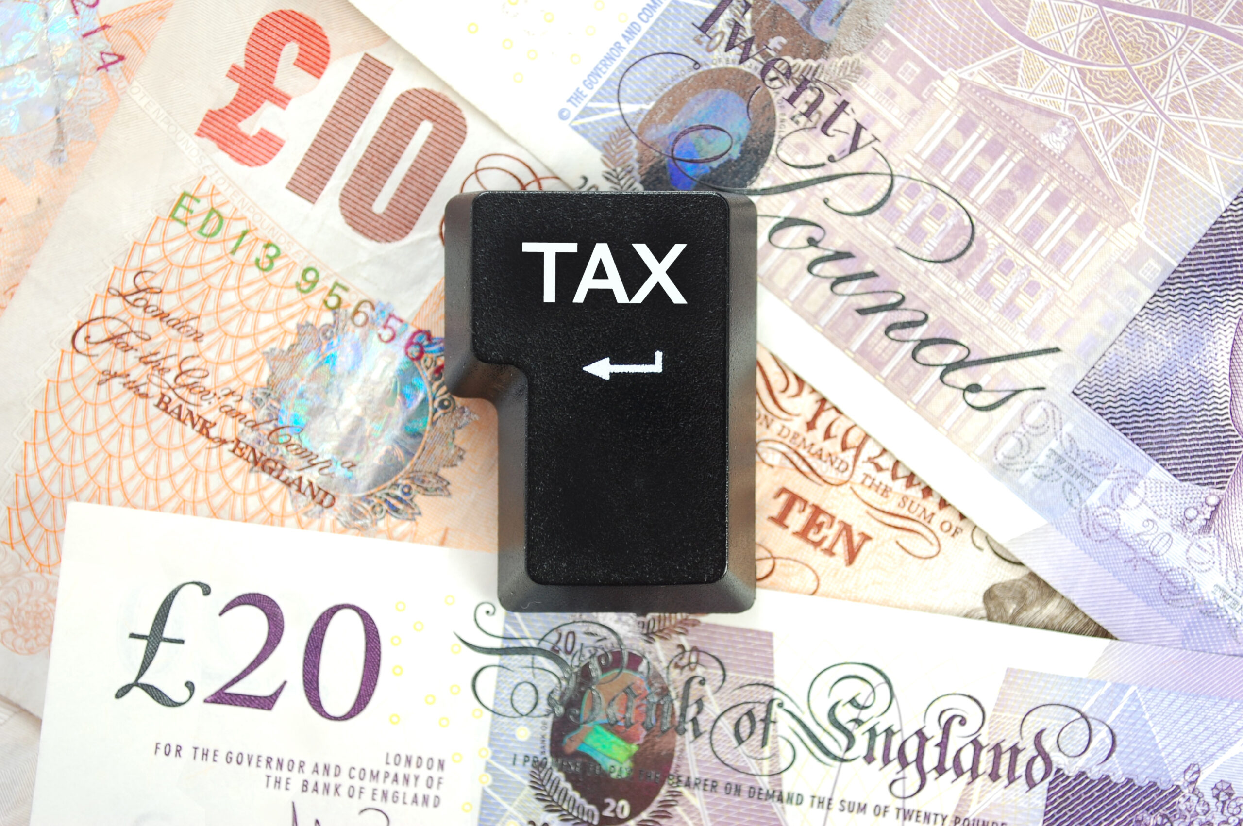 Computer hard return key with word Tax written on it, R&D tax credit concept