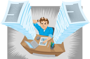 Cartoon of man seated at desk with mountains of paperwork looking worried, overtrading concept