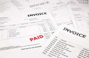 array of invoices, small business suppliers concept