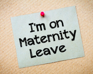 Sign saying 'I'm on maternity leave' maternity pay concept