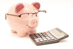 Pink piggy bank with calculator, save money concept