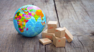 Toy globe and toy packages, import concept