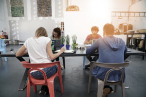 Trendy young people working in co-working office