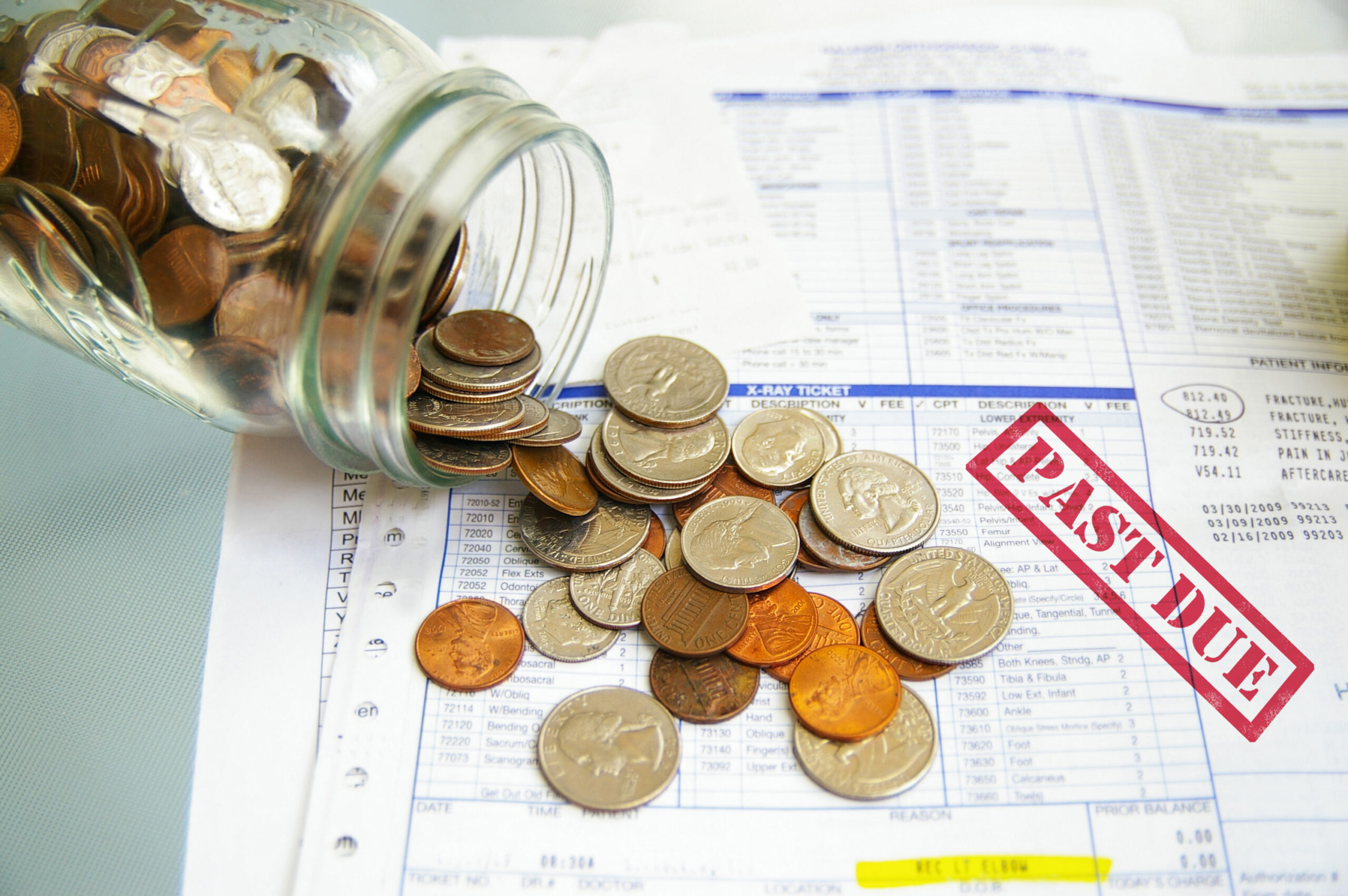 coin jar with money on Past Due medical bills