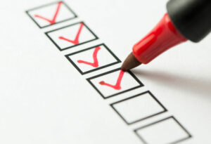 Red pen ticking checklist, free start-up checklist concept