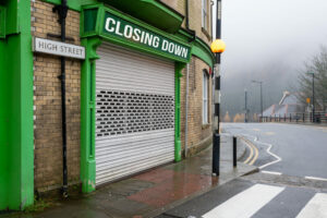 Bleak closed high street shop, corporation tax business rates concept