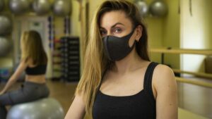 fitness trainer wearing facemask, small business lockdown concept