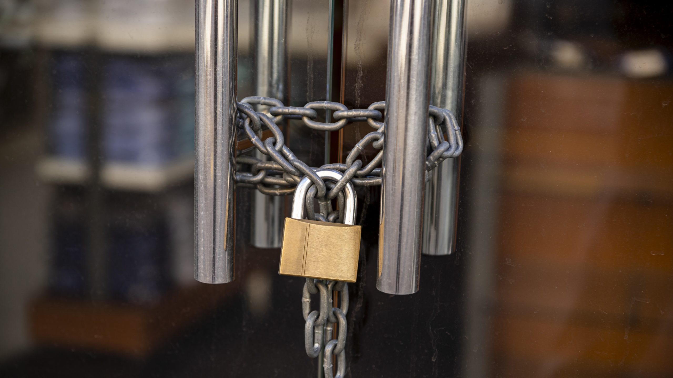 padlocked shop doors, non-payment rent concept