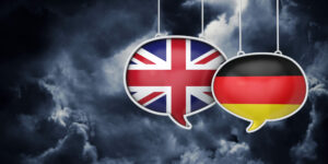 Union Jack and German flag in speech bubbles with stormy background, Germany SMEs concept