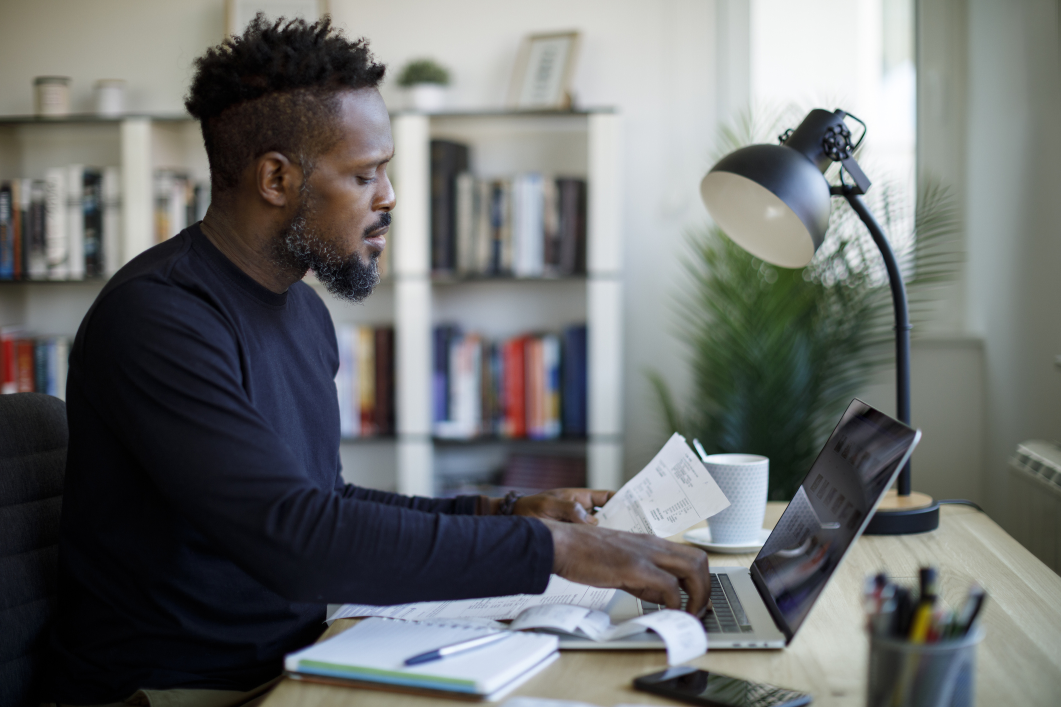 Business bank account concept. Man checking his business finances