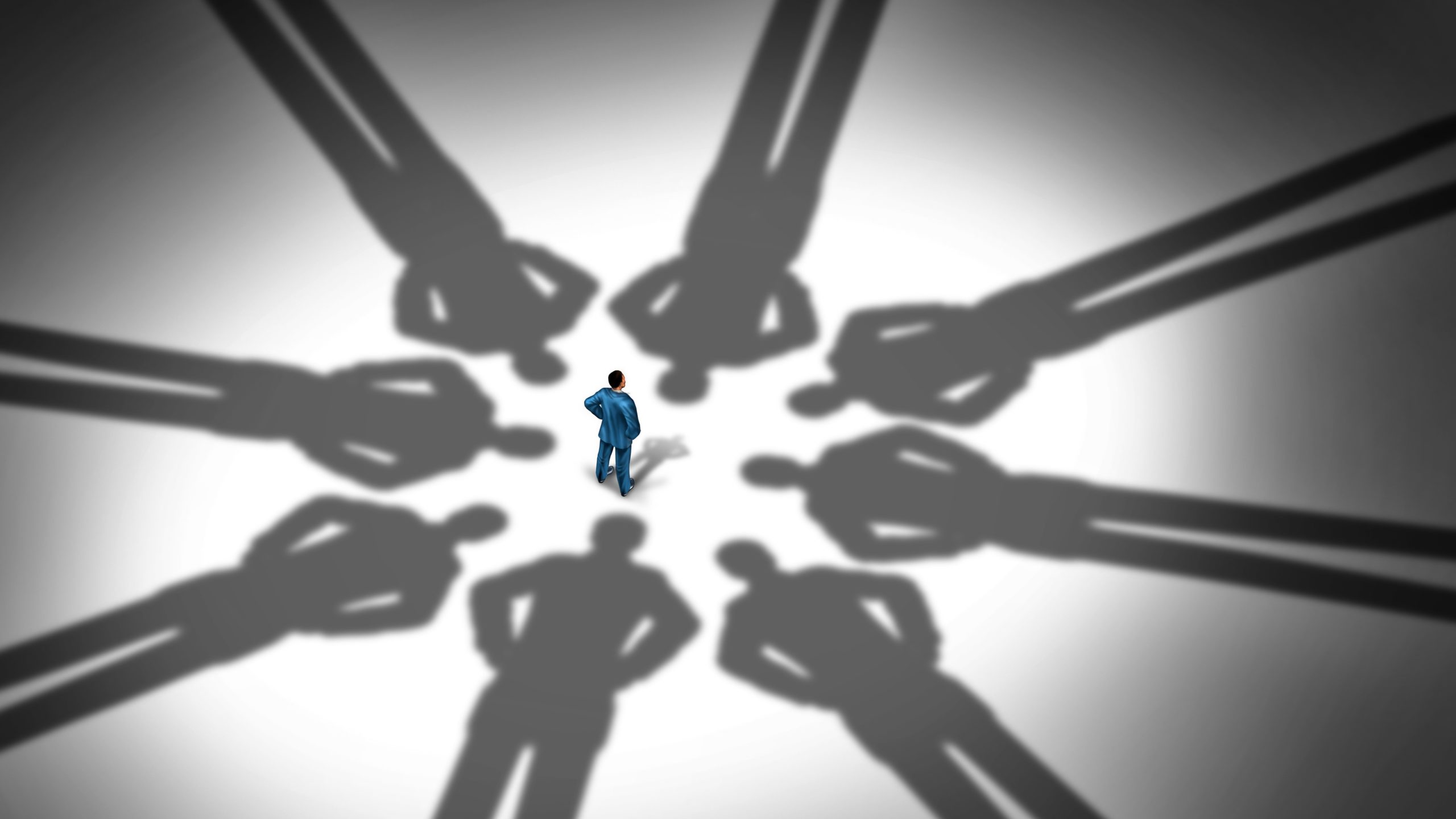Man surrounded by ominous elongated shadows, debt collection concept