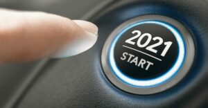 Finger pushing 2021 start button, start a business 2021 concept