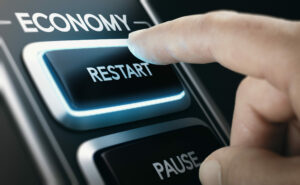 Finger pressing Restart button on economy, Restart Grant small business concept
