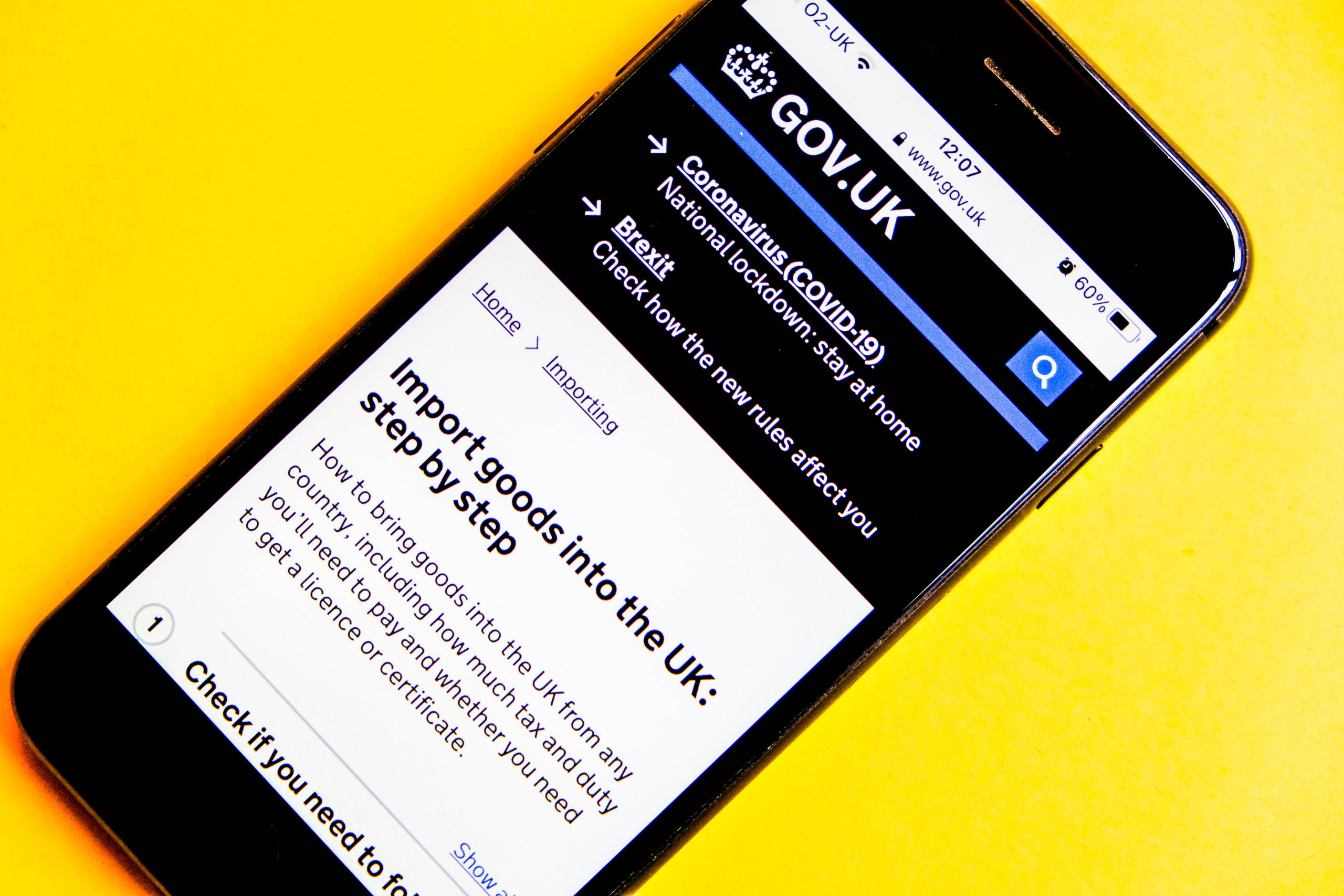 Smartphone with Government Brexit imports advice on it, Brexit supply chain concept