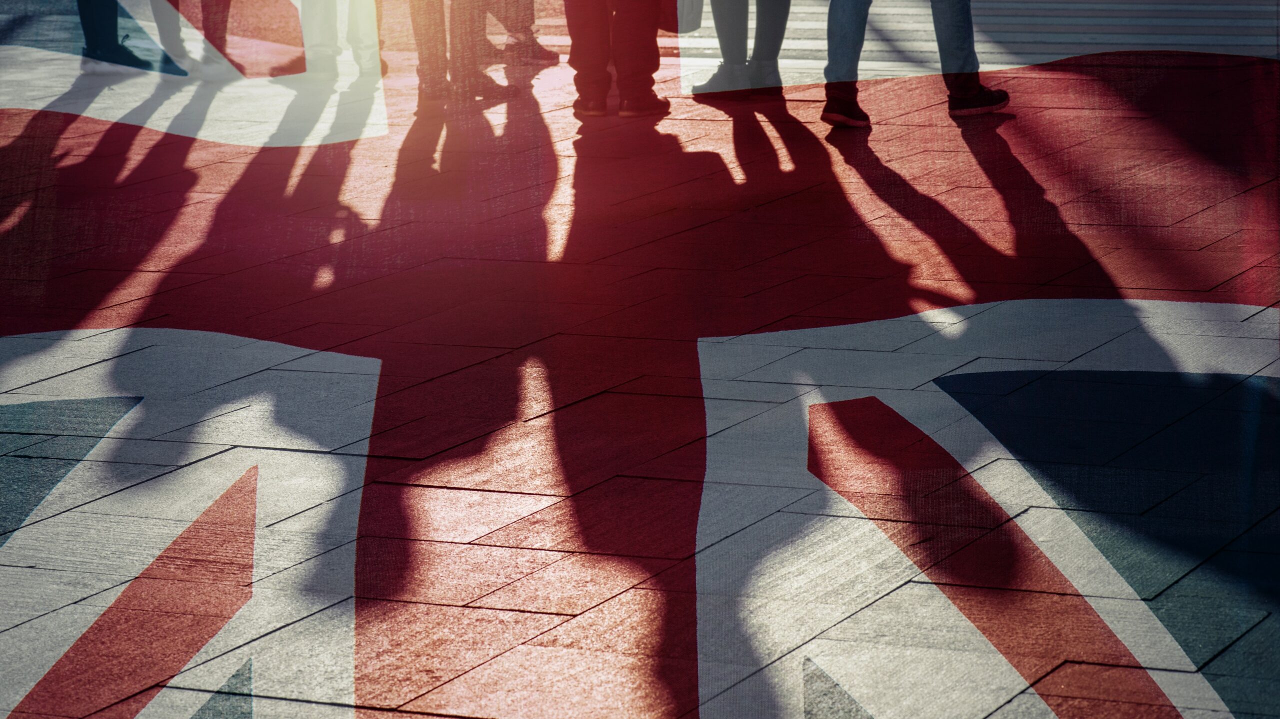 Shadows of people overlayed on Union Jack, Brexit small businesses concept