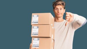 Man holding delivery boxes putting thumb down, EU customer concept