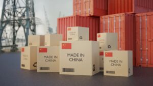 Cardboard boxes stamped Made in China on dockside, import China concept