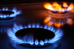 Gas burner rings alight, energy costs concept