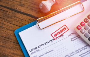 Loan application rubber-stamped 'approved' small business loans concept