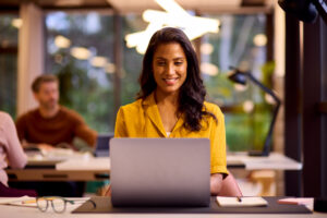 Businesswoman on laptop in office
