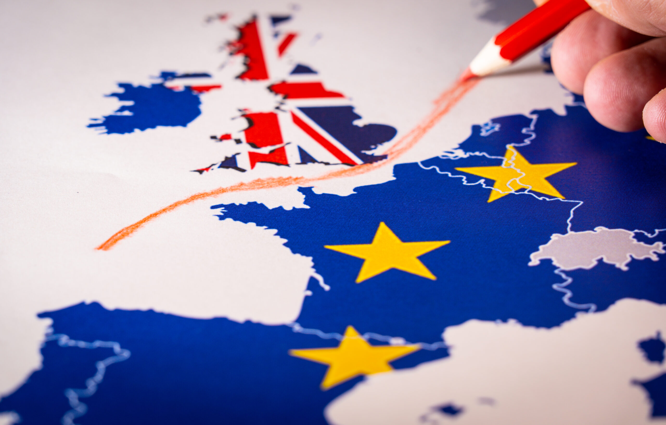 Europe map with red line being drawn between Britain and Europe, UKCA concept