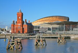 Business grants Wales concept. Vista of Cardiff Bay showing the Pier head building National Assembly for Wales and the millennium centre against a blue sky