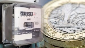Energy brokers lawsuit concept. Electricity meter beside pound coin