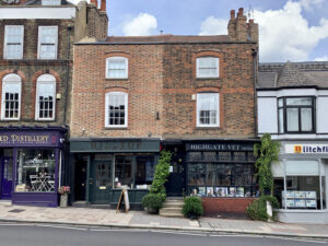 Street view of Highgate High street. Fragment of facade of local small shops. Business rates concept