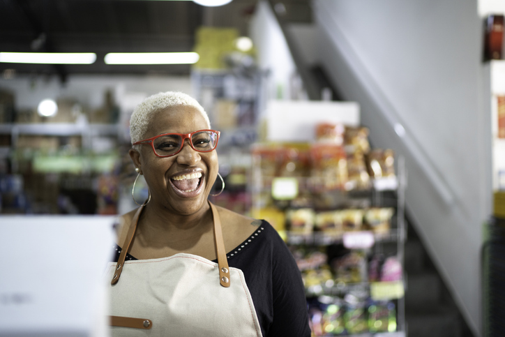 Happy cashier working at wholesale